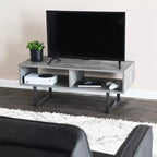 Tavolino porta TV Jamestown con vani rettangolari portaoggetti, effetto cemento ardesia rustico e metallo nero