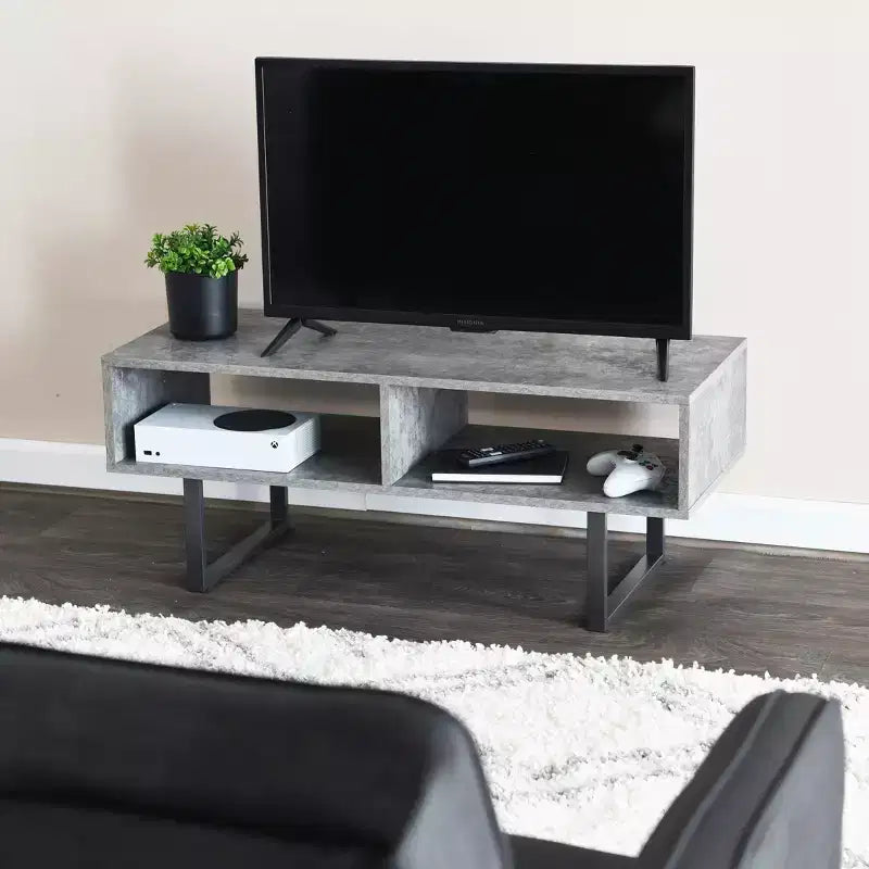 Tavolino porta TV Jamestown con vani rettangolari portaoggetti, effetto cemento ardesia rustico e metallo nero