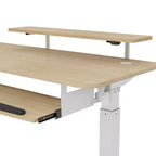 Bureau assis-debout en forme de L EUREKA ERGONOMIC 60x23 avec accessoires