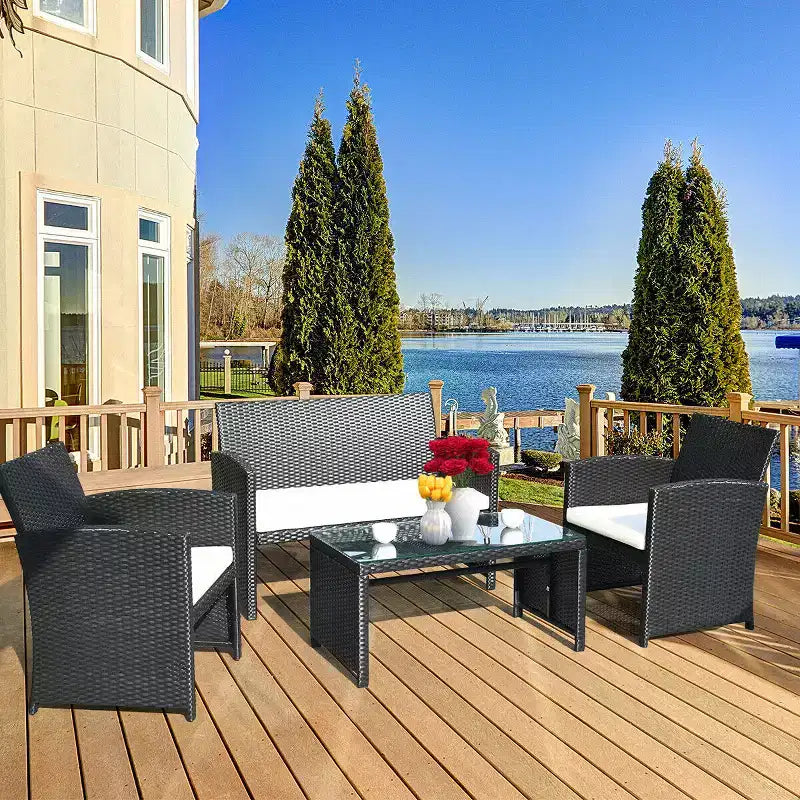 Costway Set Divani da Giardino in Rattan da 4 Pezzi con Cuscini e Tavolino, Colore Nero